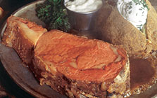 sizzling prime rib with baked potato